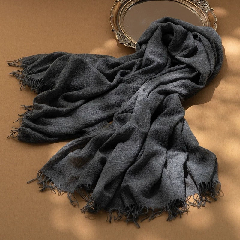Modern grey oversized cashmere scarf, styled elegantly for a timeless look.